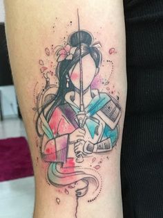 a woman's leg with a tattoo on it and an arrow in the middle