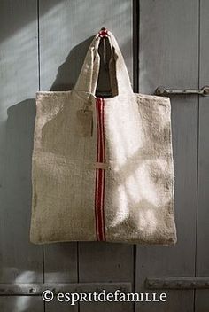 a white bag hanging on the side of a door