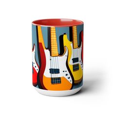 a coffee mug with guitars painted on the front and sides in red, yellow, blue, orange and white