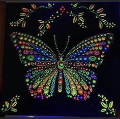 a lit up butterfly with lots of dots on it