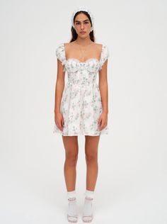 The Remi floral mini dress makes us want to go flower picking. Crafted in a rose-printed burnout fabric, this white sundress has elegant scrunchie cap sleeves, a fitted bodice with ruched cups, and is finished with an intricate lace trim along the neckline. Elegant Scrunchie, Flower Picking, Wedding Edit, Burnout Fabric, Rebecca Vallance, White Sundress, Lemon Dress, For Love & Lemons, Feminine Dress