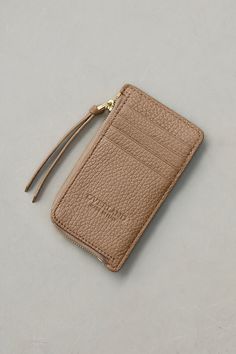 Keep your most essential personal documents secured in style with this petite wallet made from fine Italian leather. Our slim card case wallet holds your ID, credit cards, and more in a slip pocket, multiple card slots, and a main zip-around compartment. This elegant flat wallet is crafted from rich, full-grain Italian calfskin with a pebbled texture and stamped Overland logo. Elegant Card Holder With Zipper Closure For Everyday Use, Elegant Everyday Card Holder With Zipper Closure, Elegant Everyday Card Holder With Zipper, Classic Card Holder With Zipper For Daily Use, Classic Zipper Closure Card Holder For Daily Use, Rectangular Card Holder With Zipper Closure For Everyday, Everyday Rectangular Card Holder With Zipper Closure, Classic Rectangular Card Holder With Zipper Closure, Business Travel Bag