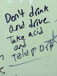 graffiti written on the side of a white wall with black writing that says don't drink and drive take aid and telepow