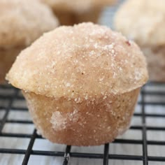 a muffin on a cooling rack with other muffins in the background