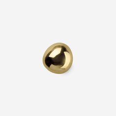 an image of a gold knob on a white background in the shape of a ball