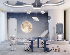 a child's room decorated in white and blue with an astronaut theme on the wall