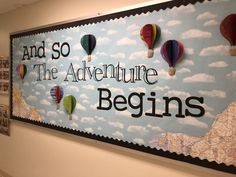 there is a sign that says and so the adventure begins with hot air balloons in the sky