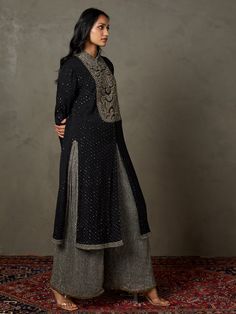 Editor's Note Dazzle in our black/grey zardozi heavy-hand-embroidered shivalika kurta, paired beautifully with palazzo pants and a coordinating dupatta. This ensemble exudes opulence and style, making it an ideal choice for special occasions and events where you want to stand out with grace and sophistication. The intricate embroidery adds a touch of grandeur to your look, ensuring you make a lasting impression with this exquisite attire. Fabric: Shimmer georgette lurex Color: Black, grey Compon Churidar Sleeves, Kurta Palazzo Set, Black Kurta, Ritu Kumar, Palazzo Set, Pattern Embroidery, Thread Embroidery, Churidar, Mandarin Collar