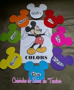 mickey mouse cut outs with colors and words on the front, along with other disney characters