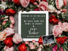 a baby announcement surrounded by flowers and photos