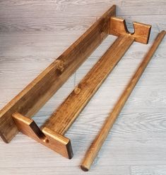 two wooden benches sitting on top of a white floor