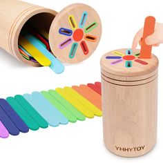 the wooden toy is next to an assortment of colorful toys