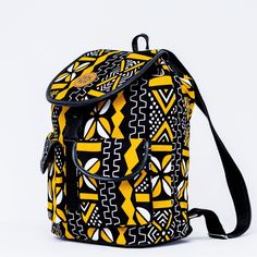 ANKARA MONKEY BACK-PACK. Whether you're seeking a leisure bag or a daily hardy everyday use back-pack this is it ! Handmade in Kenya from Ankara / Dashiki Cloth overlay on tough, hardy canvas fabric, it has two outside pockets and one zipper pocket inside.The top has a plastic buckle fastener and a drawstring to keep the items in the bag secure. A definite wardrobe must have! Overview: - Handmade item. Primary color:yellowMaterials: Canvas Fabric, Ankara cloth, Metalic zip enclosure Length: - 12 Yellow Leather School Backpack, Yellow Leather Backpack For School, Yellow Backpack For Outdoor Activities, Yellow Standard Backpack For Outdoor Activities, Yellow Leather Standard Backpack, Yellow Leather Backpack With Adjustable Strap, Yellow Standard Backpack For Travel, Yellow Leather Backpack For Daily Use, Yellow Travel Backpack