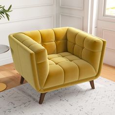 a yellow chair sitting on top of a white rug