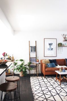 a living room filled with furniture and decor