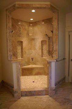 a walk in shower sitting inside of a bathroom