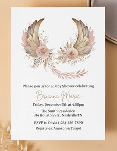 a baby shower party with feathers and flowers