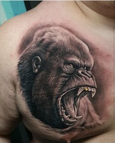 a man with an angry gorilla tattoo on his chest