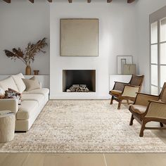 a living room filled with furniture and a fire place in the middle of a room