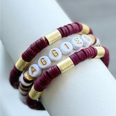 Texas A&M Aggies Stackable Heishi Polymer Clay Bracelet Stack. Perfect For Game Days. Bracelets Are Each Custom Made With Brass Beads, High Quality Hypoallergenic 18k Gold Filled Spacer Beads, & Heishi Beads. Message Seller To Customize With Your Favorite Word Or Slogan. Instruction: 1. Each Bracelet Is Custom Made To Size. (Please See Photo For Wrist Sizing Measurement Instructions.) * Please Double Check Your Wrist Size And Double Check The Size You Ordered. Care: Keep Bracelets Dry And Away F Hand Bracelets, Keep Bracelet, Bracelet Stuff, Polymer Clay Bracelet, Clay Bracelet, Brass Beads, Texas A&m, Heishi Beads, Favorite Words