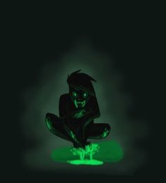 a person sitting in the dark with green light on their feet and arms, holding a knife