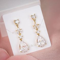 "Very romantic crystal bridal earrings. Gorgeous earrings for your special day! They measure about 1 1/4\" long and 1/4\" wide. High quality guaranteed by GlamourBrideUSA! SHIPPING: Standard Shipping: 4-6 business days Priority mail Shipping: 2-3 business days *INTERNATIONAL ORDERS: PLEASE NOTE CUSTOMERS ARE RESPONSIBLE FOR ALL DUTIES & TAXES*" Wedding Long Drop Linear Earrings In Cubic Zirconia, Gold Teardrop Linear Earrings For Weddings, Crystal Linear Earrings For Wedding, Gold Linear Earrings For Wedding, Long Drop Crystal Earrings For Wedding, Rose Gold Drop Crystal Earrings For Wedding, Crystal Dangle Earrings For Wedding, Gold Cubic Zirconia Bridal Earrings For Bridesmaids, Cubic Zirconia Dangle Earrings For Bridesmaids