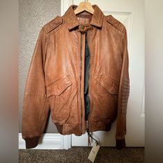 Greetings! I Bought This Jacket A Few Years Ago In Milan. I Never Got Around To Use It And Now I Have My Grail Leather Jacket. New With Tags, It Says Us Xs Size But I’m Between A 36 And 38 Chest And It Fits Me Well. Professionally Moisturized. Approximate Sizes, Zipped Up, Laying Flat: Chest 19.5” Pit To Pit, Length 23.5” Bottom Of Collar To Hem, Sleeves 26” Top Of Shoulder To End Of Cuff. Hope This Helps! Casual Fitted Leather Jacket With Flap Pockets, Casual Brown Leather Jacket With Zipper, Casual Brown Biker Jacket With Padded Collar, Brown Leather Jacket With Padded Collar For Spring, Spring Brown Leather Jacket With Padded Collar, Brown Casual Leather Jacket With Padded Collar, Casual Brown Leather Jacket With Padded Collar, Urban Fitted Leather Jacket With Pockets, Flat Chest