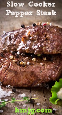 slow cooker pepper steak on a cutting board with lettuce and seasoning