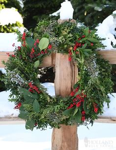 a wooden post with a wreath on it