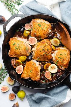 chicken thighs with figs and olives in a cast iron skillet