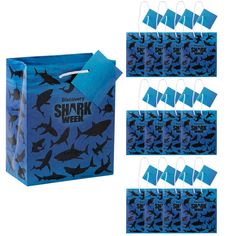 shark week gift bags with tags and handles are shown in multiple colors, including blue