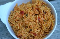 a white bowl filled with rice and vegetables