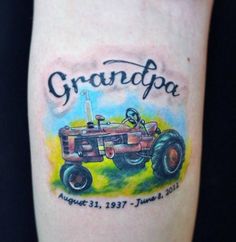 a tattoo with an old tractor on it