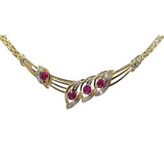 18K Yellow Gold Natural Diamond & Ruby Necklace   Metal Type: 18K (750) Yellow Gold Total Item Weight: 24.4 Grams Necklace Length: 17 Inch (Resizable) 1) Natural Diamond Weight: 0.80 Ct. Diamond Clarity Grade: SI2-SI2 Diamond Color Grade: J-K Diamond Shape: Round Shape 2) Stone: Natural Burmese Ruby Stone Shape: Oval Full Cut No. Of Stone: 4 Stone Weight: 1.35 Ct. Diamond Ruby Necklace, Burmese Ruby, Diamond Color Grade, Ruby Necklace, Ruby Stone, Diamond Color, Burmese, Diamond Shape, Metal Necklaces