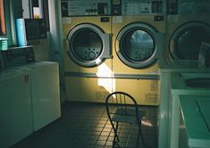 a washer and dryer in a small room