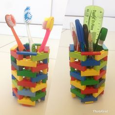 two cups with toothbrushes and pencils in them