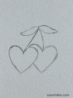 two hearts with an umbrella drawn on paper