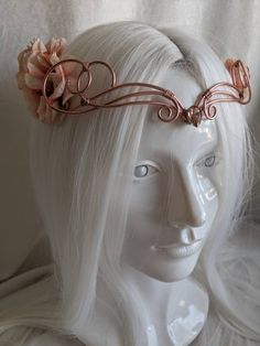 A beautiful, intricate crown with a rose gold crystal decorating the center of the matching wire and brilliant multi-colored pink roses surrounding the piece. Eyes will follow the delicate swirls and romantic roses as the garland decorates your head, perfect for renaissance fairs, weddings, cosplay, or any event of your choosing! If you want a different wire color or crystal color/shape, let me know! :) Whimsical Adjustable Pink Crown, Rose Gold Roses, Woodland Tiara, Rapunzel Crown, Rose Tiara, Wire Crown, Wired Jewelry, Fantasy Crown, Gold Armor