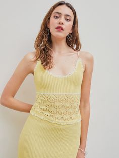 a woman in a yellow dress posing for the camera Seamless Summer Knit Top, Seamless Knit Top For Summer, Cotton Knit Tank Top For Spring, Spring Cotton Knit Tank Top, Fitted Cotton Pointelle Knit Sweater, Spring Cotton Knitted Tank Top, Spring Cotton Stretch Knit Top, Seamless Cotton Knit Top For Summer, Summer Seamless Cotton Knit Top