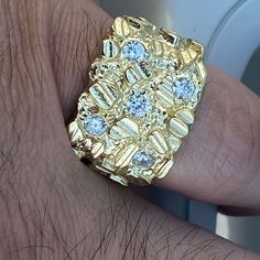 Mens real solid 925 silver nugget ring. 14K gold plated over 925 sterling silver. Stamped "925" on inside of ring band. Available in sizes 7, 8, 9, 10, 11, 12, 13. Stamped on the inside of the band "925". Diamond cuts on the rectangular nugget. Five man made round-cut stones shine hard. Solid pieces weigh 9 to 11 grams each. Genuine solid 925 silver, not cheap metal. Real ring that won't turn your fingers green. Beautiful rings that are jewelry masterpieces. Choose ring from pinky size 7 to size Gold Nugget Ring, Smoky Quartz Ring, Diamond Ice, Gold Nugget, Real Jewelry, Hip Hop Jewelry, Quartz Ring, Ring Band, Sterling Ring