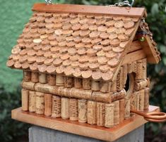 a bird house made out of wine corks