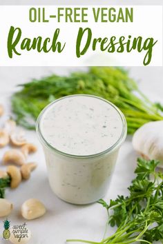 an image of ranch dressing in a glass jar with mushrooms and parsley on the side