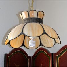 a light fixture hanging from the ceiling in a room