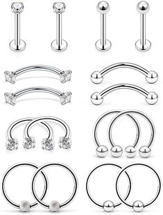 six pairs of surgical piercings with balls on each side and two nose rings in the middle