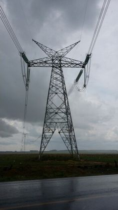 the power lines are high above the road