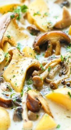 a white bowl filled with soup and mushrooms