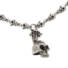 "Bring back that punk rock rebellion with our Sterling Silver Skull Necklace. Dark and ominous, a chain of menacing skull heads glare out at passers by. The focus draws in on a skull cross and larger skull head pendant, encrusted with black stones in a mohawk design. A gothic symbol that finds its way into biker style, this necklace makes a strong and powerful statement. This entire necklace is crafted from solid sterling silver. This creates a premium feel - in both weight and finish - that pro Silver Mens Necklace, Mens Chain, Mens Chain Bracelet, Punk Skull, Skull Pendant Necklace, Dragon Bracelet, Silver Chain For Men, Biker Jewelry, Mens Necklace