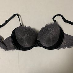 Gorgeous Black Satin And Gray Lace Adore Me Bra Is Brand New Without Tags. Lightly Padded Cups And Underwire. Size Is 40d. From A Smoke And Pet Free Home. Elegant Fitted Gray Bra, Gray Underwire Bra With Padded Cups, Fitted Gray Push-up Bra, Gray Fitted Push-up Bra, Elegant Gray Underwire Bra, Black Full Cup Lace Bra, Black Lase Bra, Black Delicate Lace Evening Bra, Black Low-cut Lace Bra