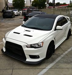 a white car parked in a parking lot