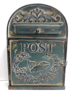 an old fashioned mailbox with a bird on it's front and the word post written